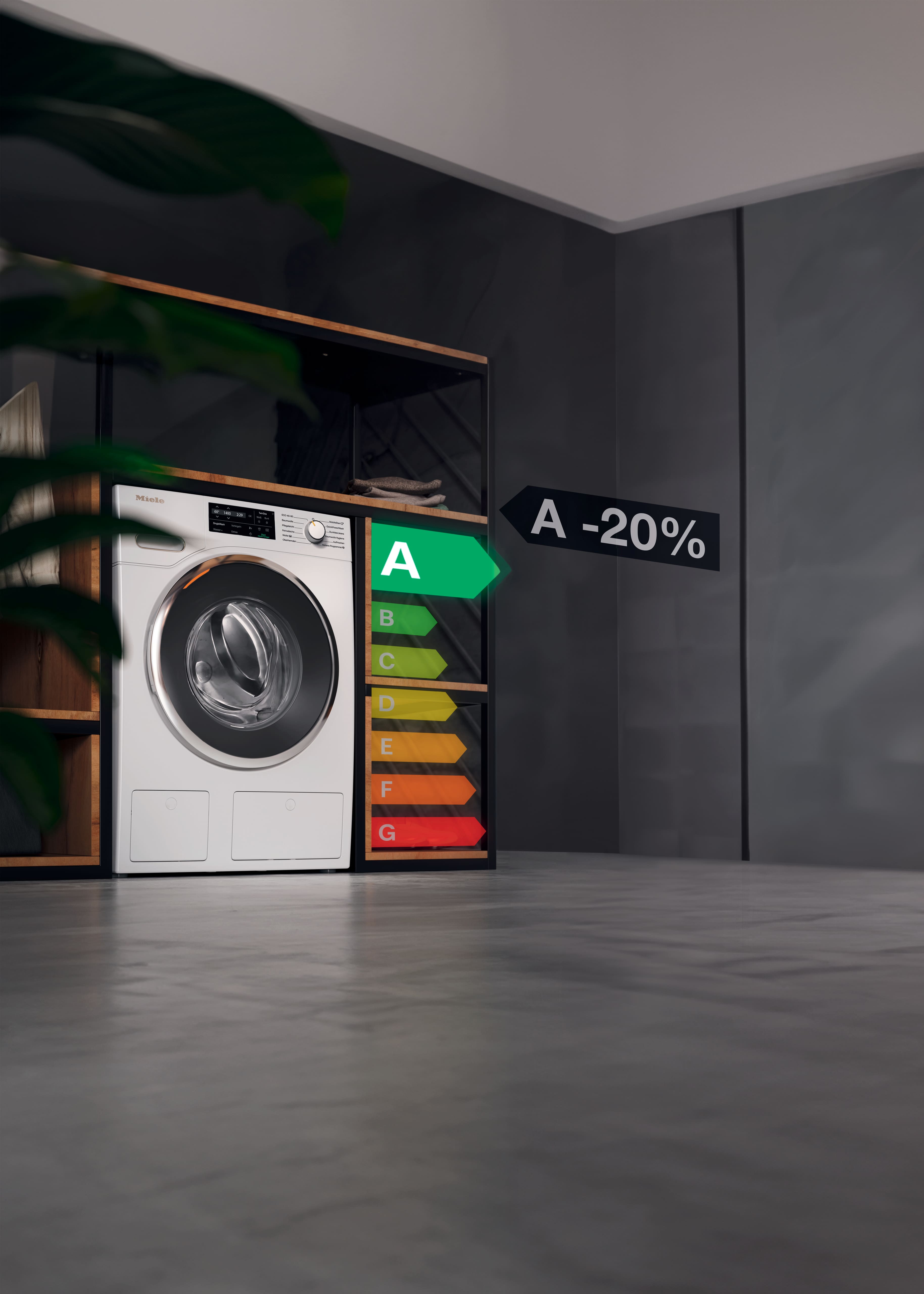 Modern laundry room scene featuring a Miele front-loading washing machine set in a black-and-wood shelving unit. Next to it is a colorful energy efficiency rating scale highlighting grade A, and a black sign reading “A -20%.” Concrete floor, dark gray walls, and soft moody lighting. Modern laundry room scene featuring a Miele front-loading washing machine set in a black-and-wood shelving unit. Next to it is a colorful energy efficiency rating scale highlighting grade A, and a black sign reading “A -20%.” Concrete floor, dark gray walls, and soft moody lighting.
