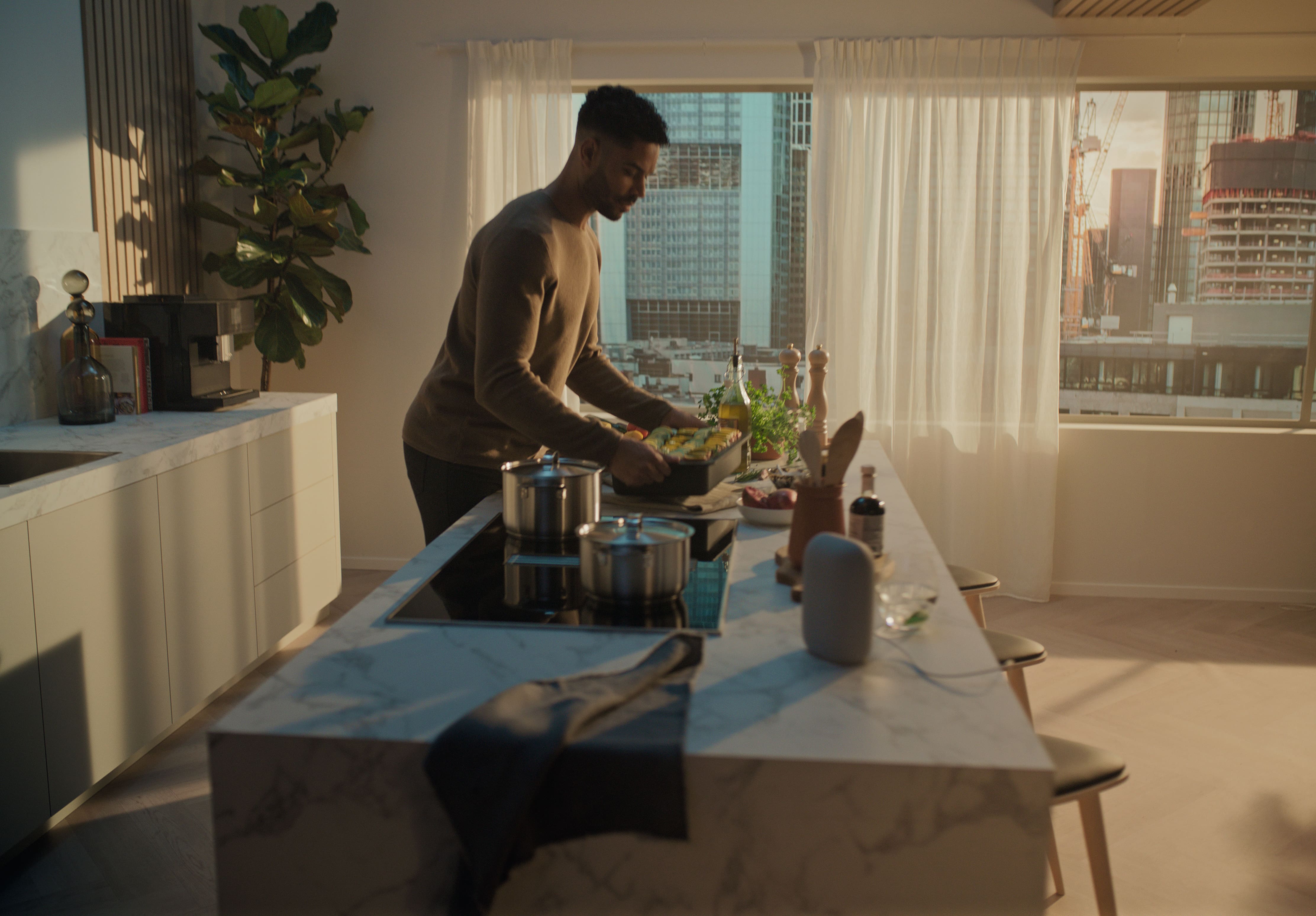 man cooking with Miele appliances