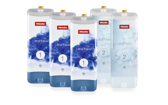 Fem Miele UltraPhase tvättmedelspatroner, tre märkta 