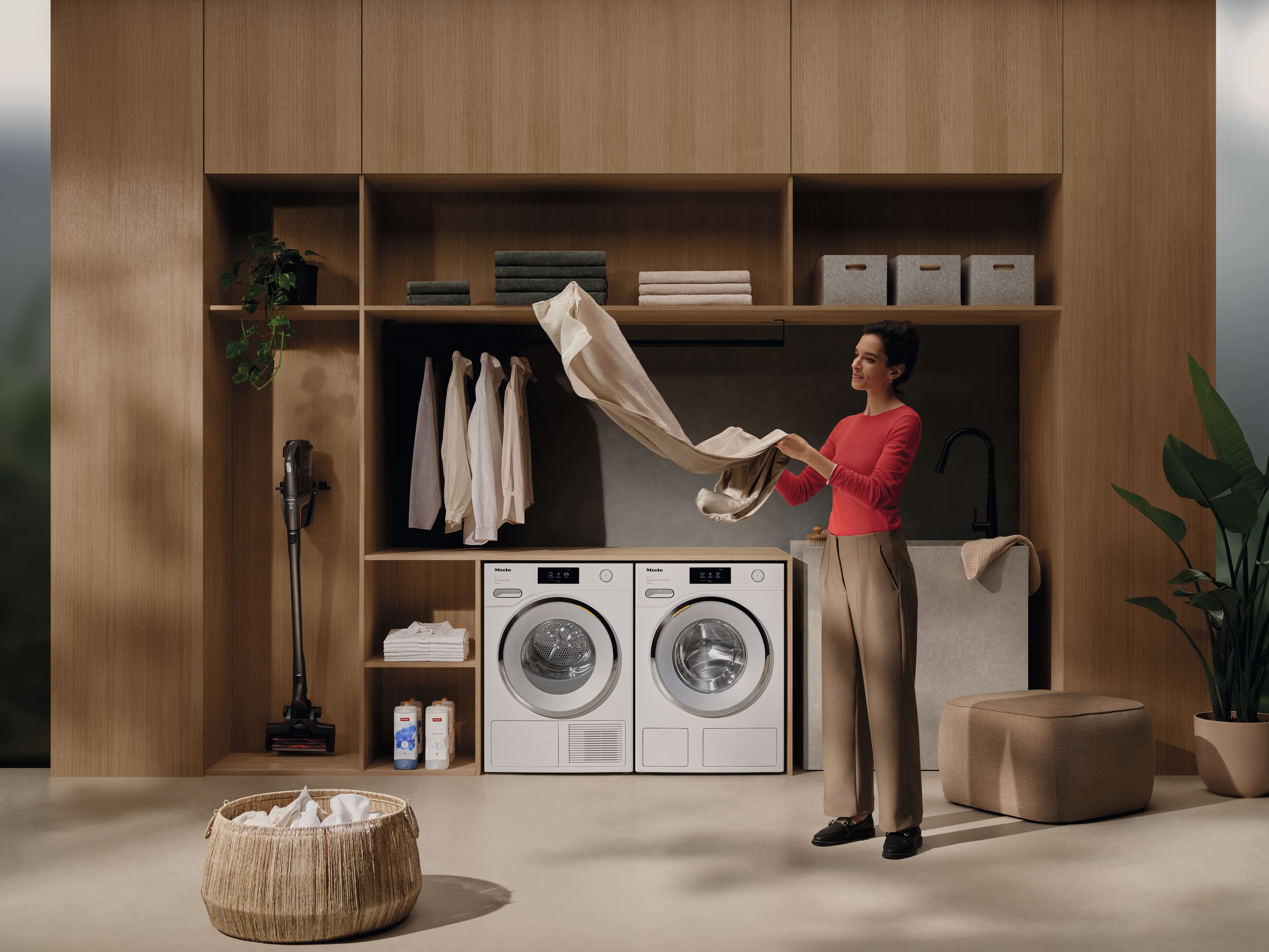 A laundry room with a Miele washing machine and a dryer