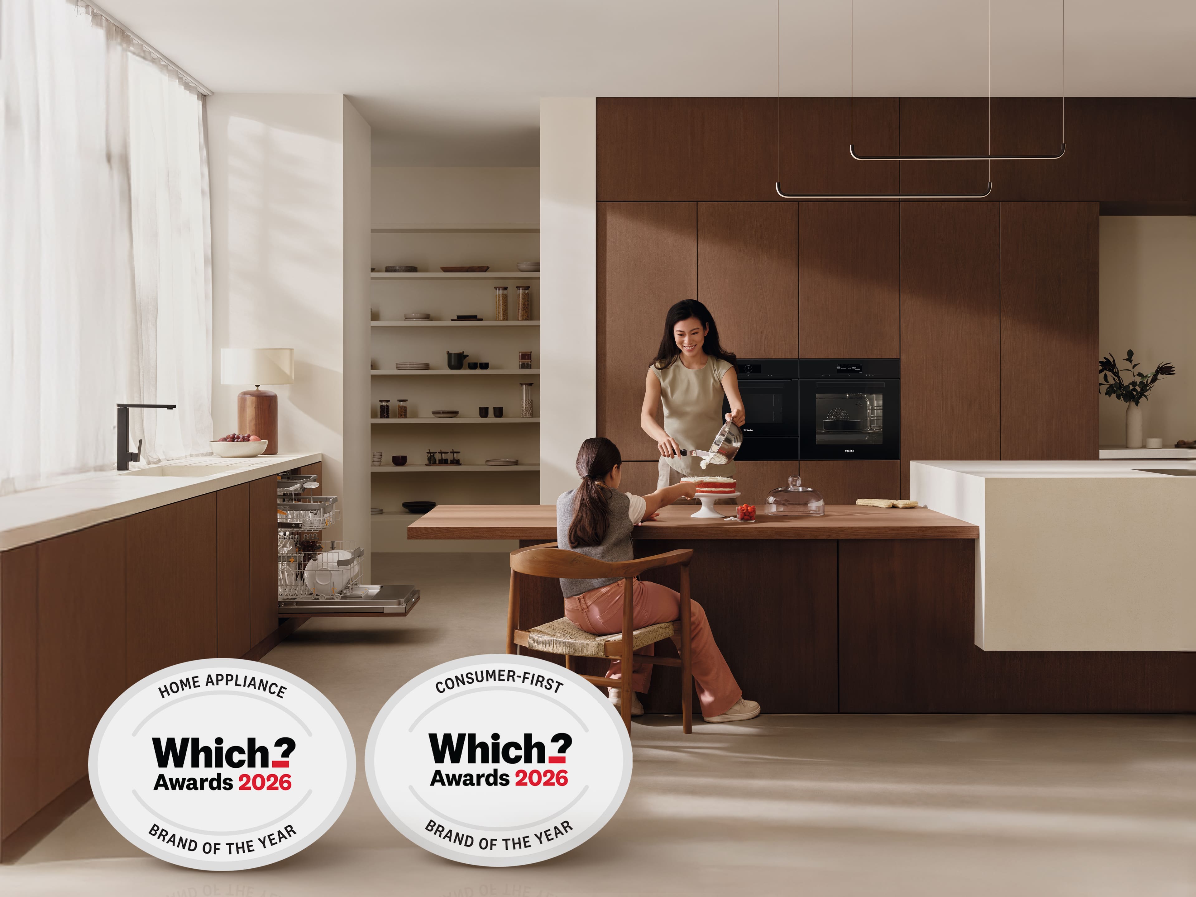 Woman and daughter baking a cake in a Miele kitchen Woman and daughter baking a cake in a Miele kitchen