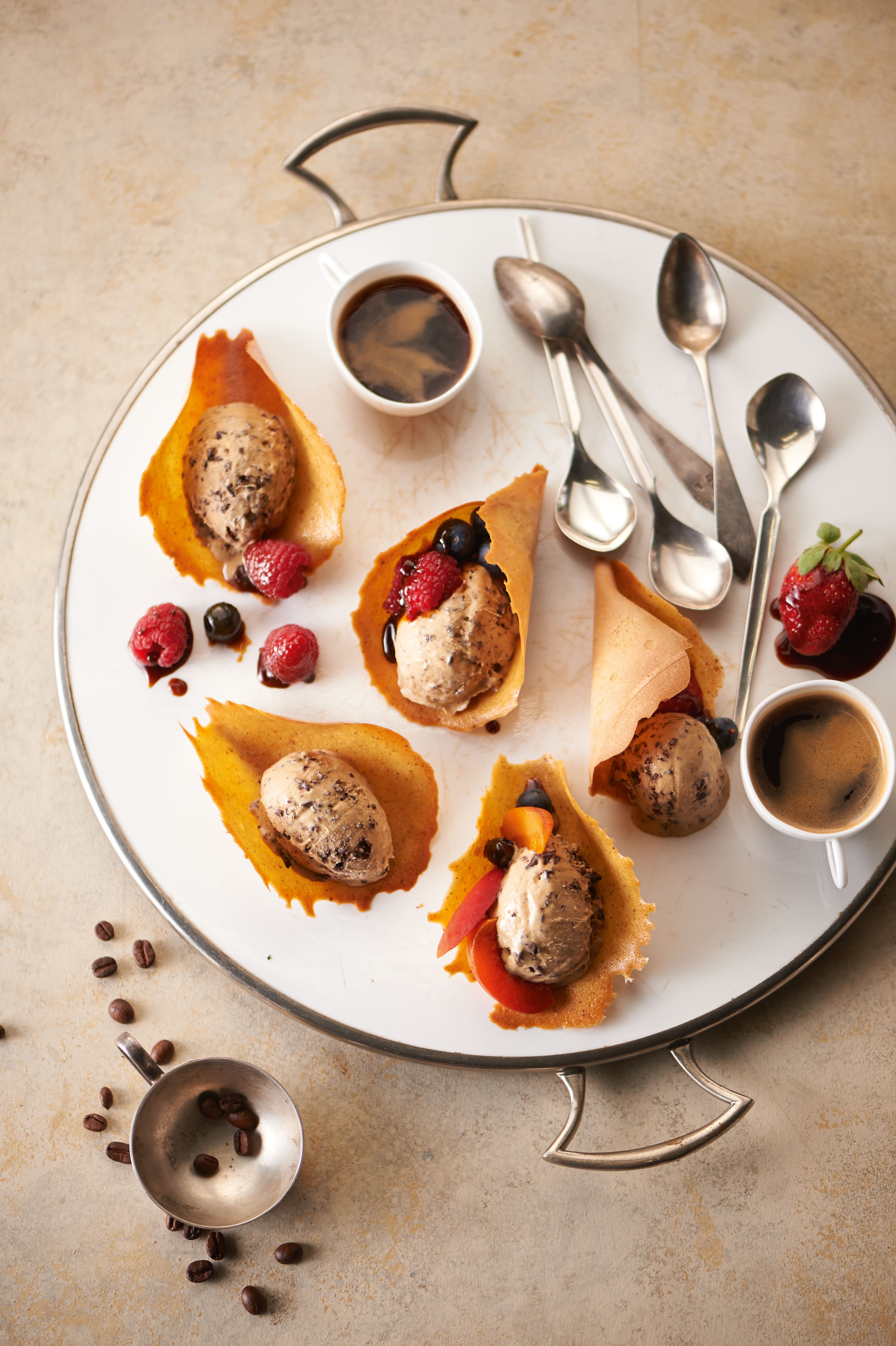 Artful dessert platter with tuile cups holding chocolate chip gelato, fresh berries, and espresso. Artful dessert platter with tuile cups holding chocolate chip gelato, fresh berries, and espresso.