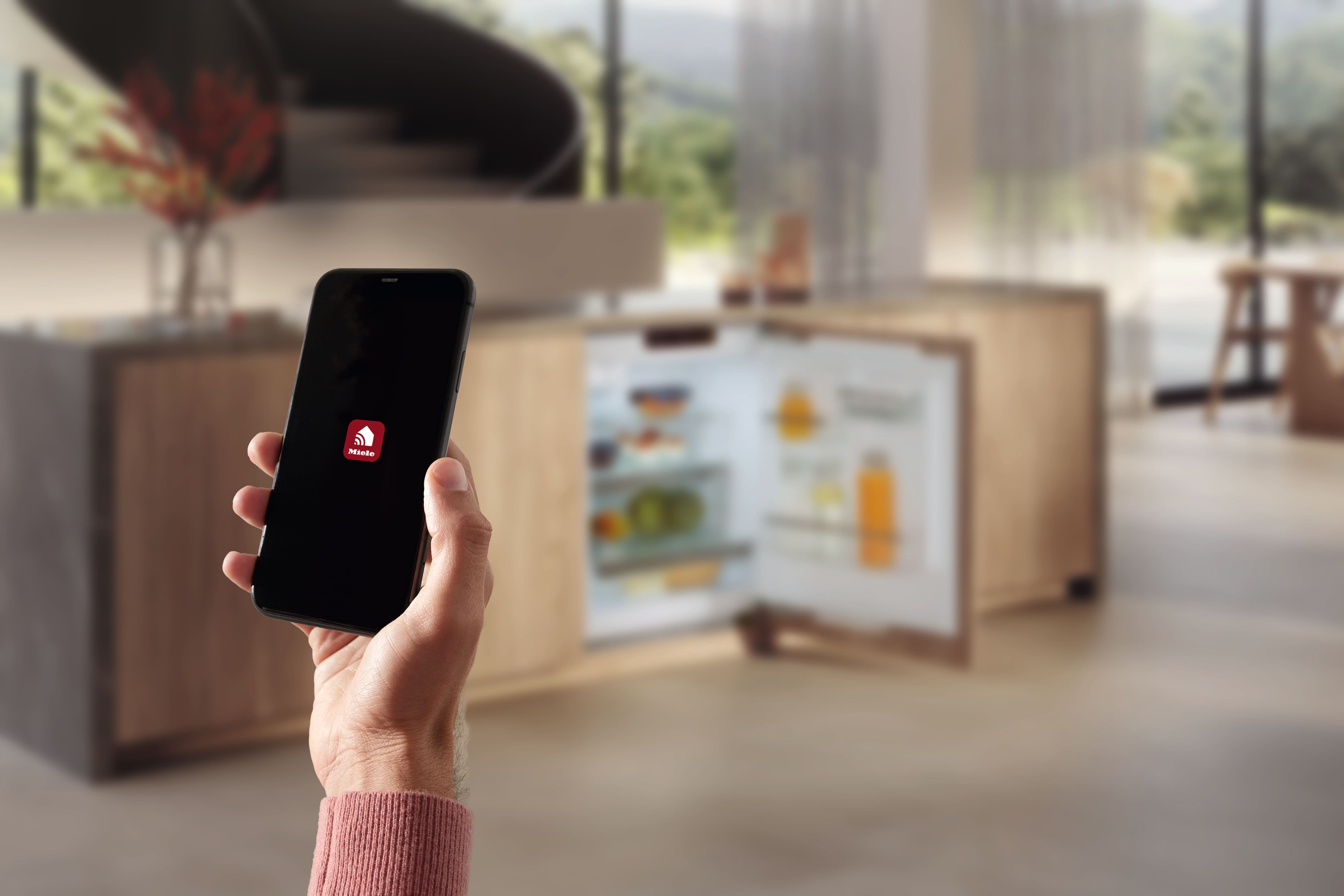a phone with the Miele app starting