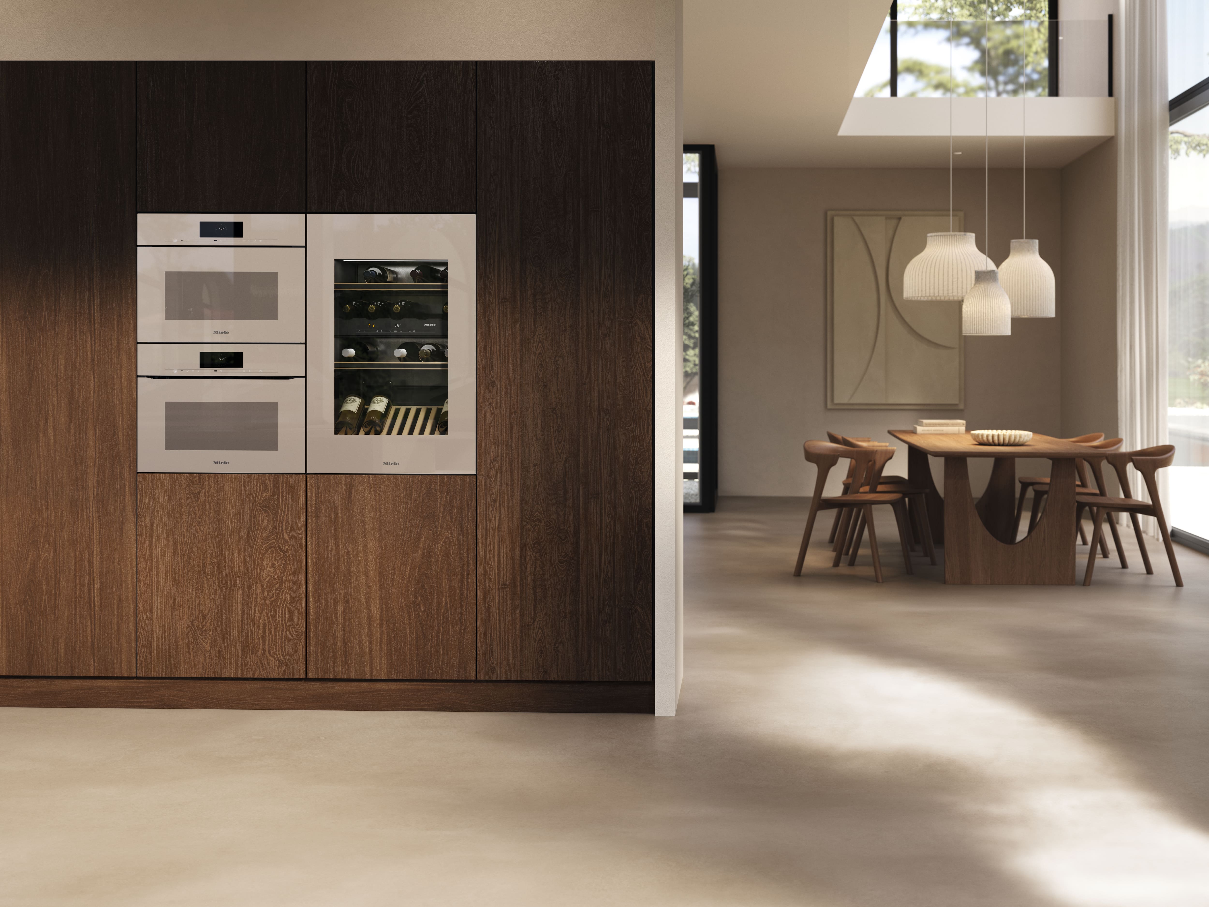 A modern kitchen equipped with Miele household appliances in the color Pearl Beige. A modern kitchen equipped with Miele household appliances in the color Pearl Beige.