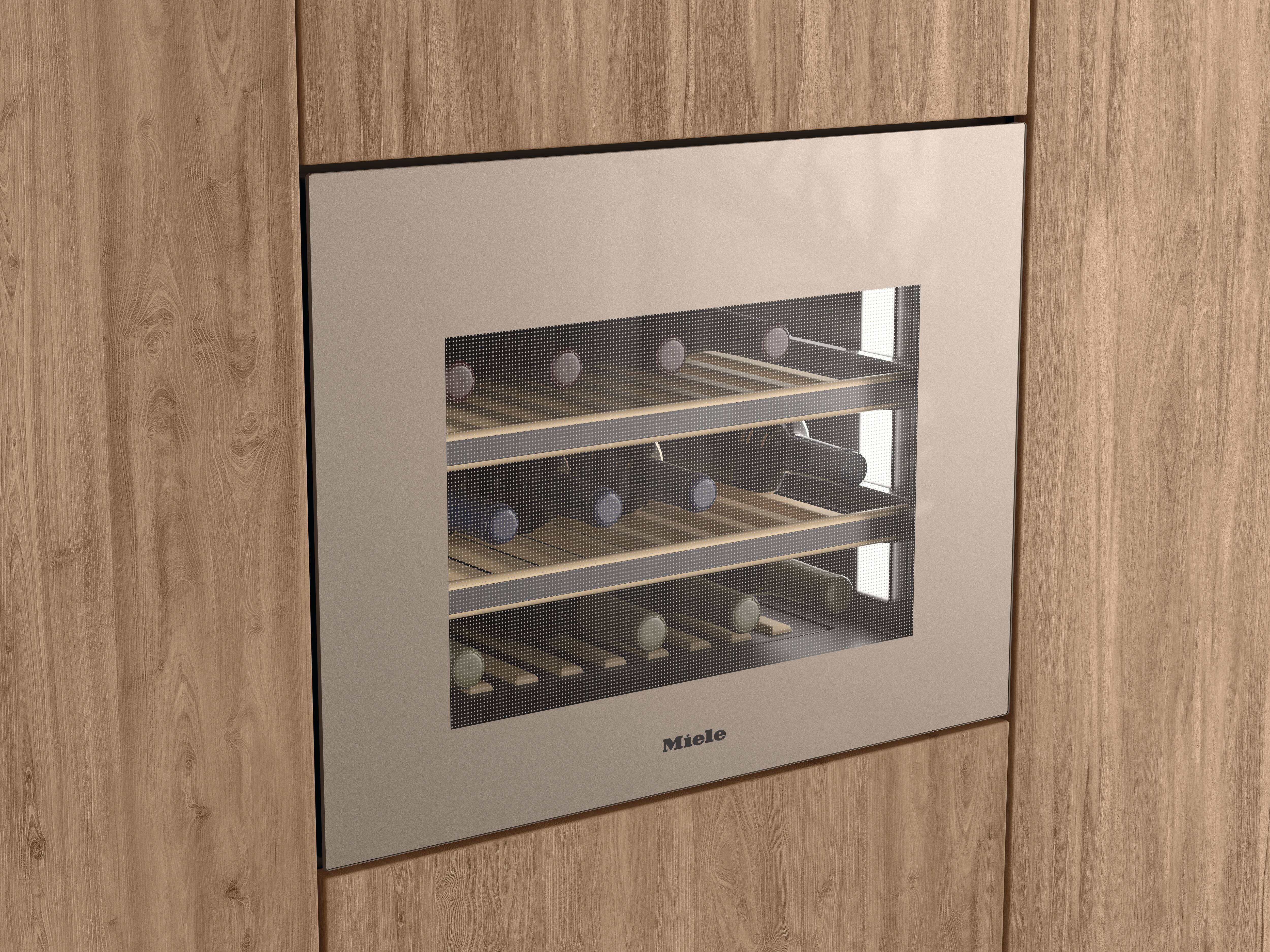 Built-in wine cooler with a glass front and wooden shelves, stocked with wine bottles, integrated into light wood cabinetry; 'Miele' logo on the door. Built-in wine cooler with a glass front and wooden shelves, stocked with wine bottles, integrated into light wood cabinetry; 'Miele' logo on the door.