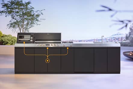 Modern outdoor kitchen island with Miele grill, pizza oven, side burner and sink; orange callouts highlight cabinet modules.