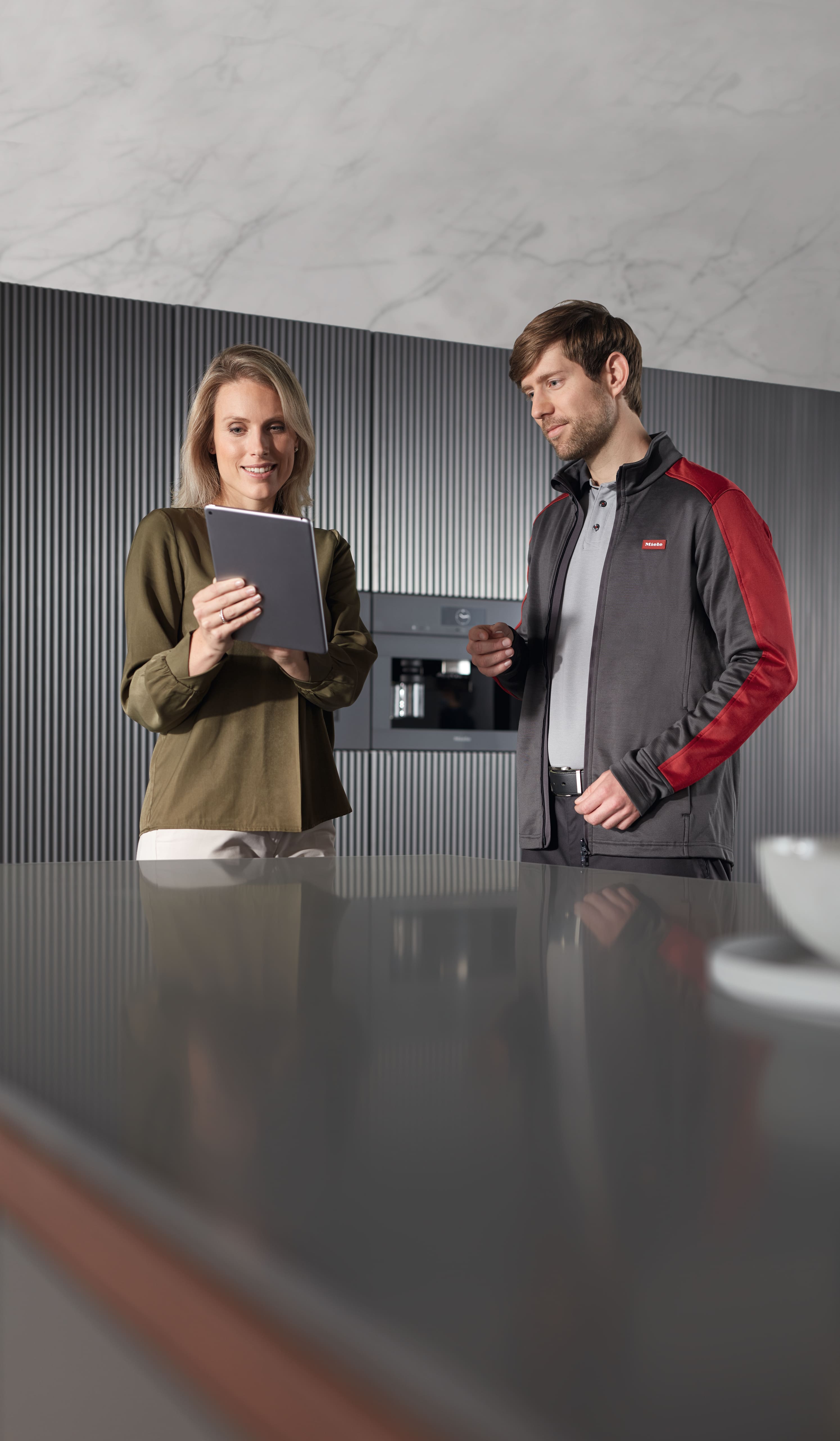 Woman registering her product for a Miele Extended Warranty Woman registering her product for a Miele Extended Warranty