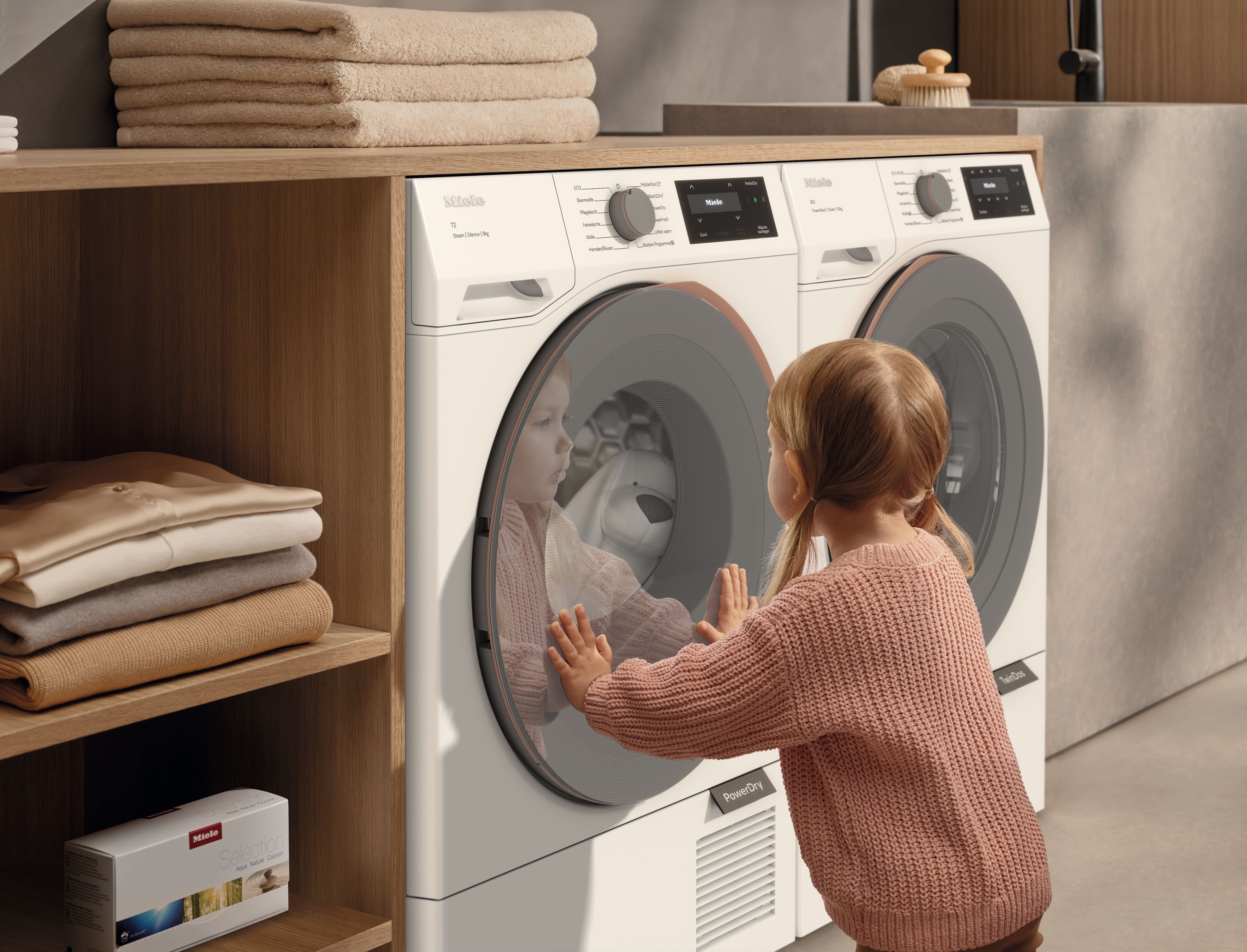 girl in front of washing machine girl in front of washing machine