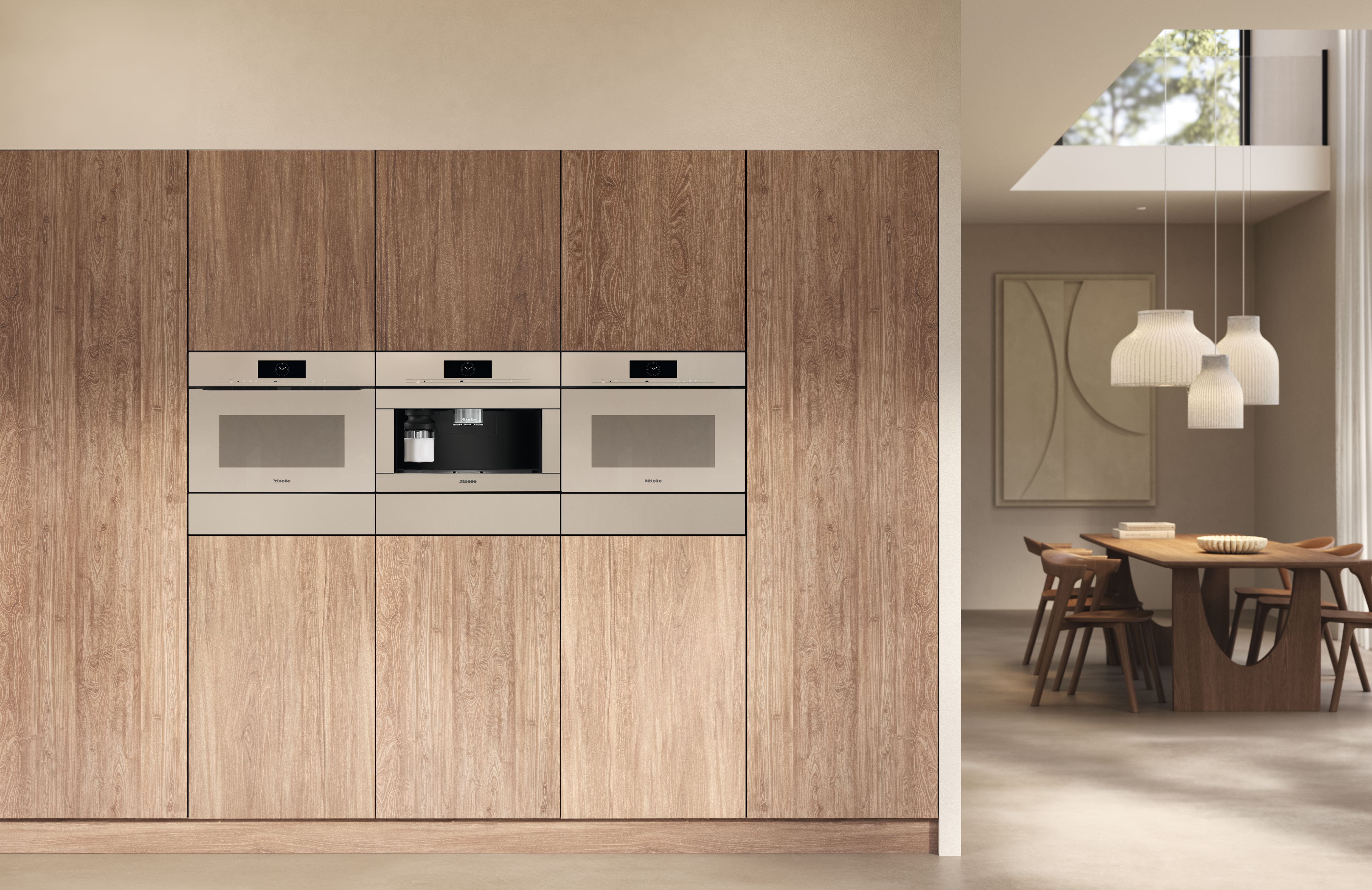 A kitchen outfitted with Miele appliances showcases an elegant pearl beige design A kitchen outfitted with Miele appliances showcases an elegant pearl beige design