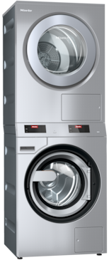 Stacked front-load Miele washer and dryer in stainless steel with round glass doors and digital touch displays.