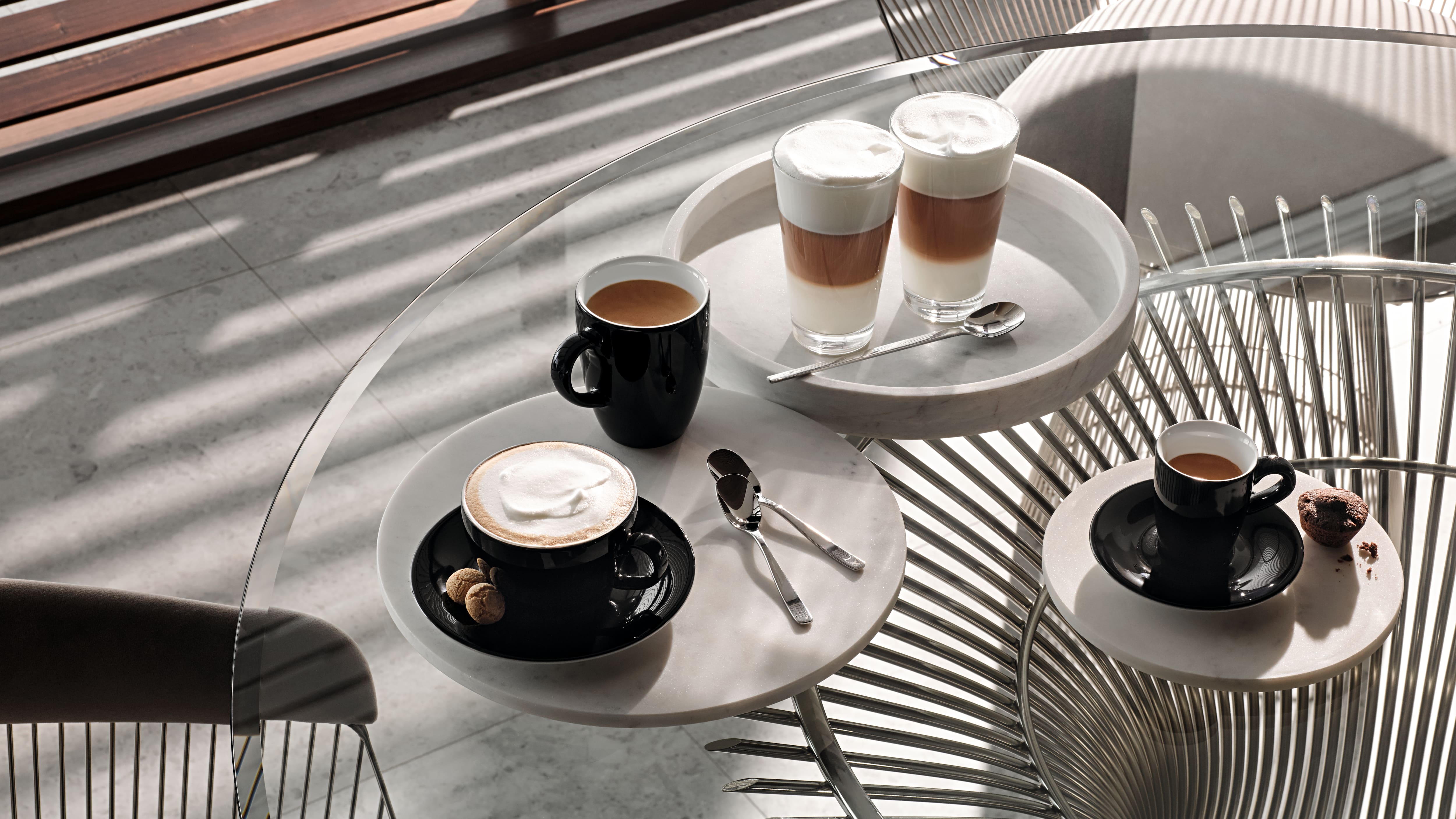 Miele's pearl beige appliances: Oven, Coffee Machine, and Steam Oven. Miele's pearl beige appliances: Oven, Coffee Machine, and Steam Oven.
