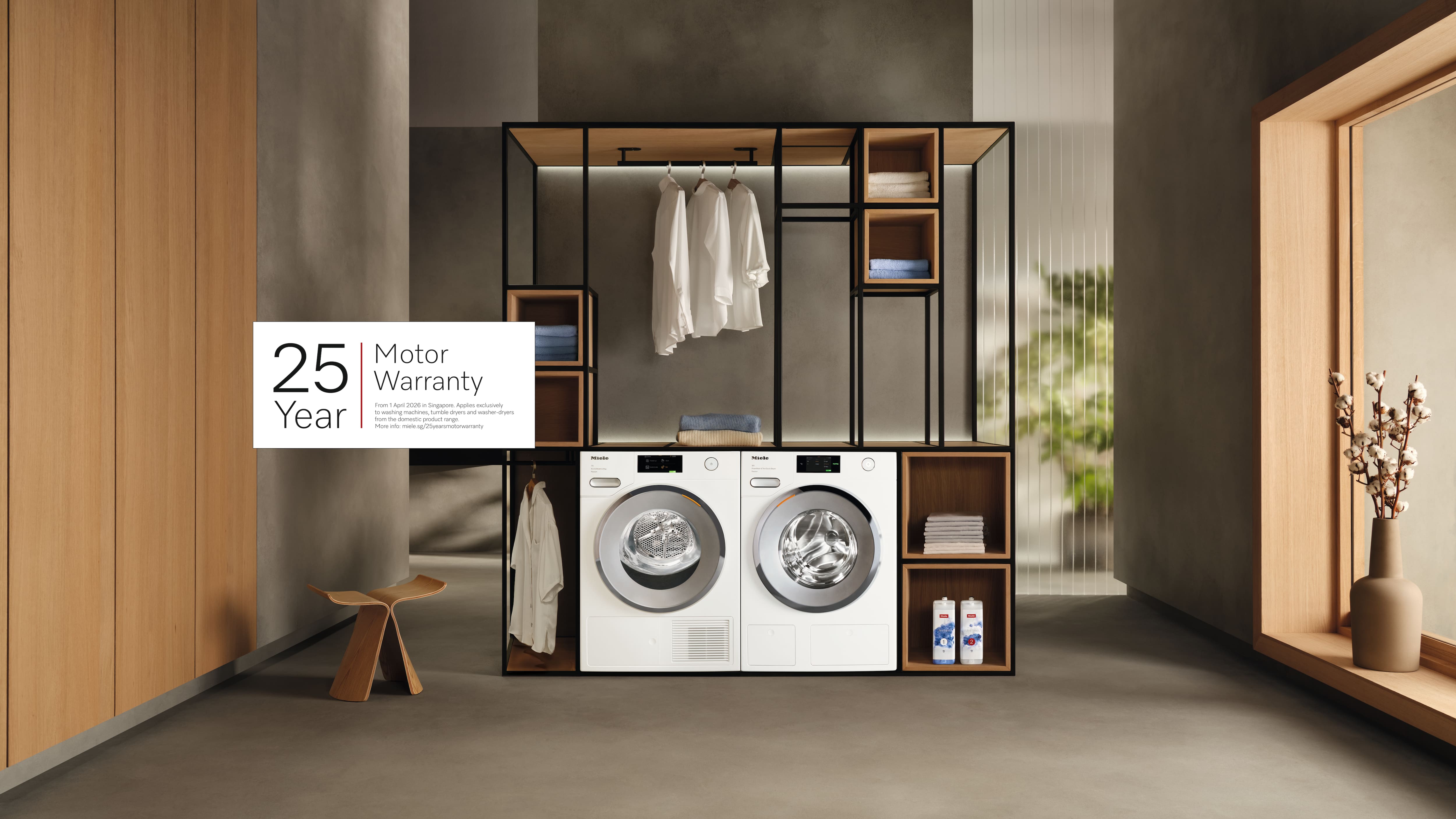 Modern laundry room featuring Miele washer and dryer, open shelving, and a banner for a 25-year motor warranty.