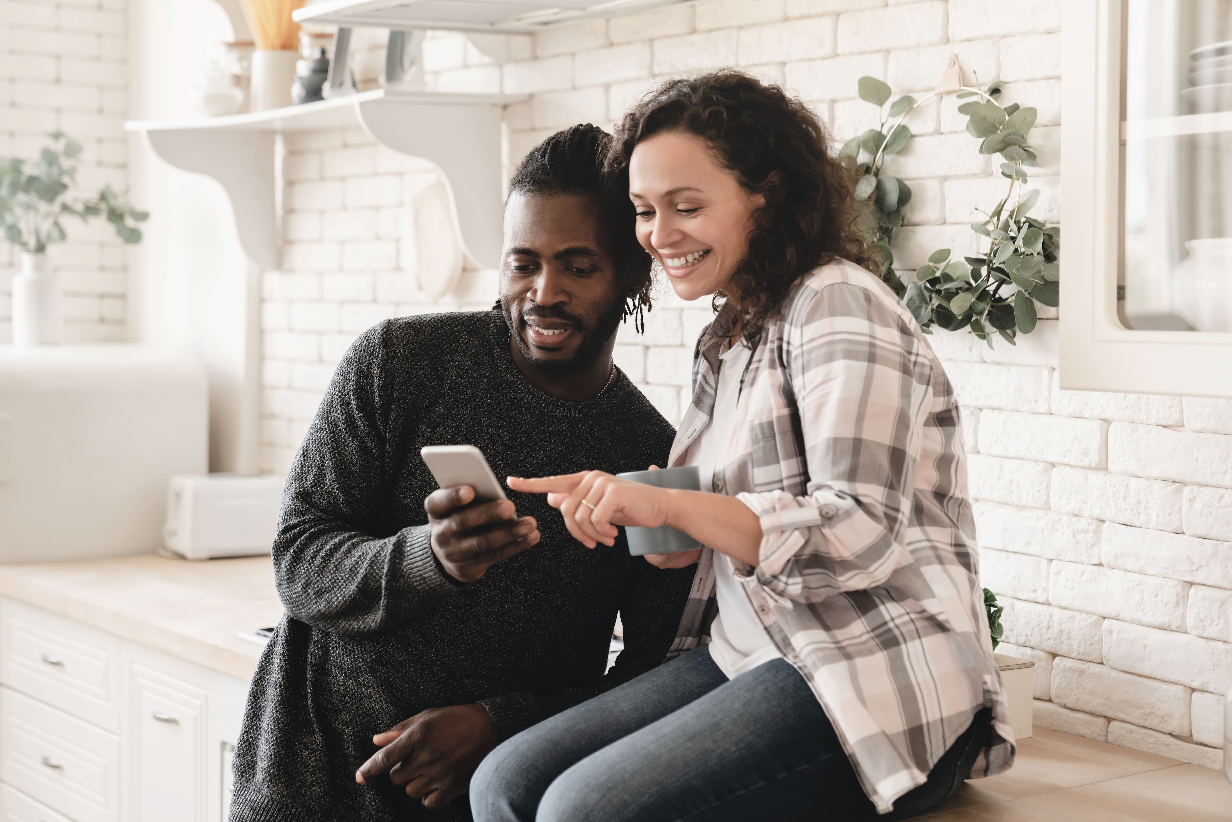 A young couple is checking out something interesting on a tablet