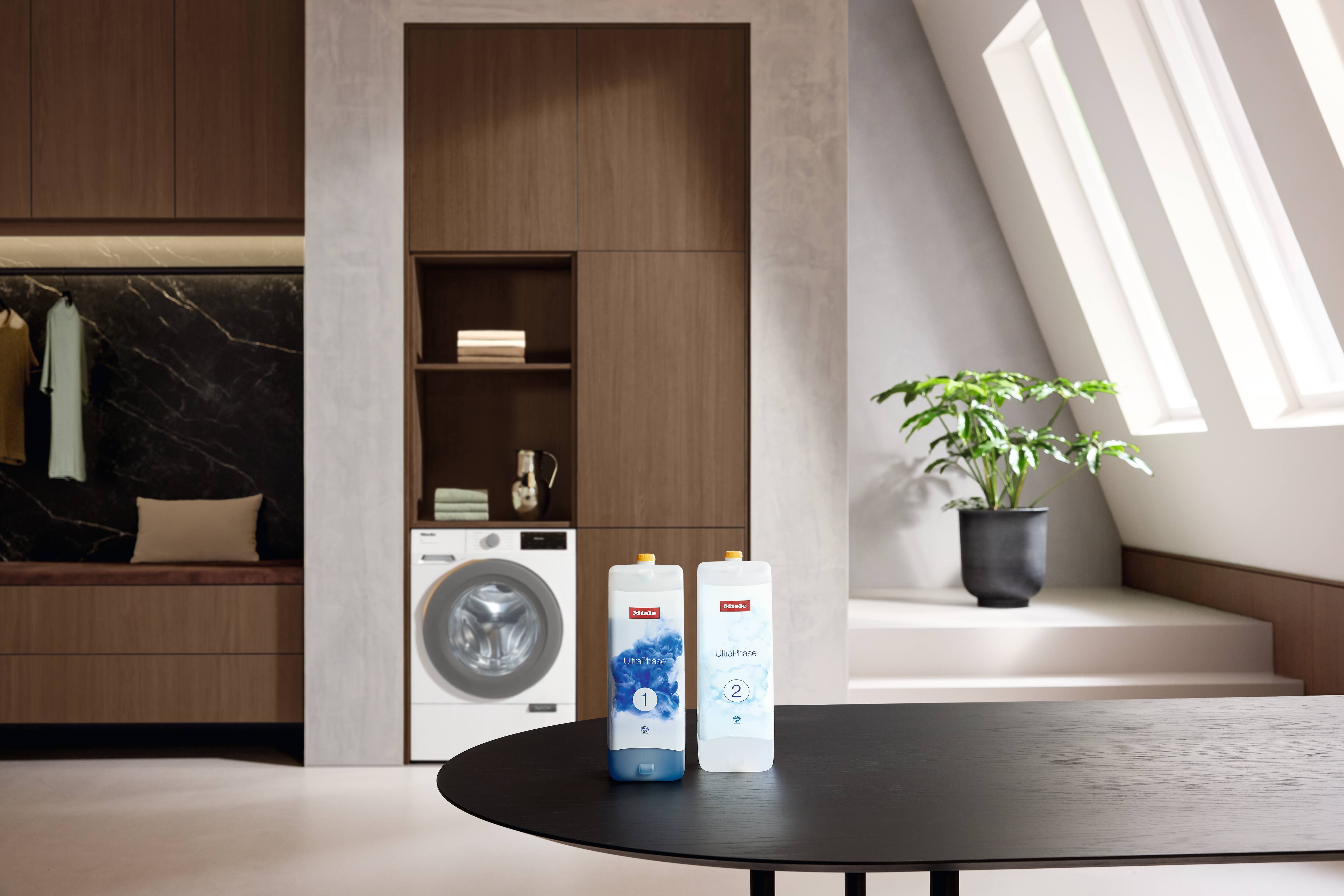 Two Miele detergents with washing machine Two Miele detergents with washing machine