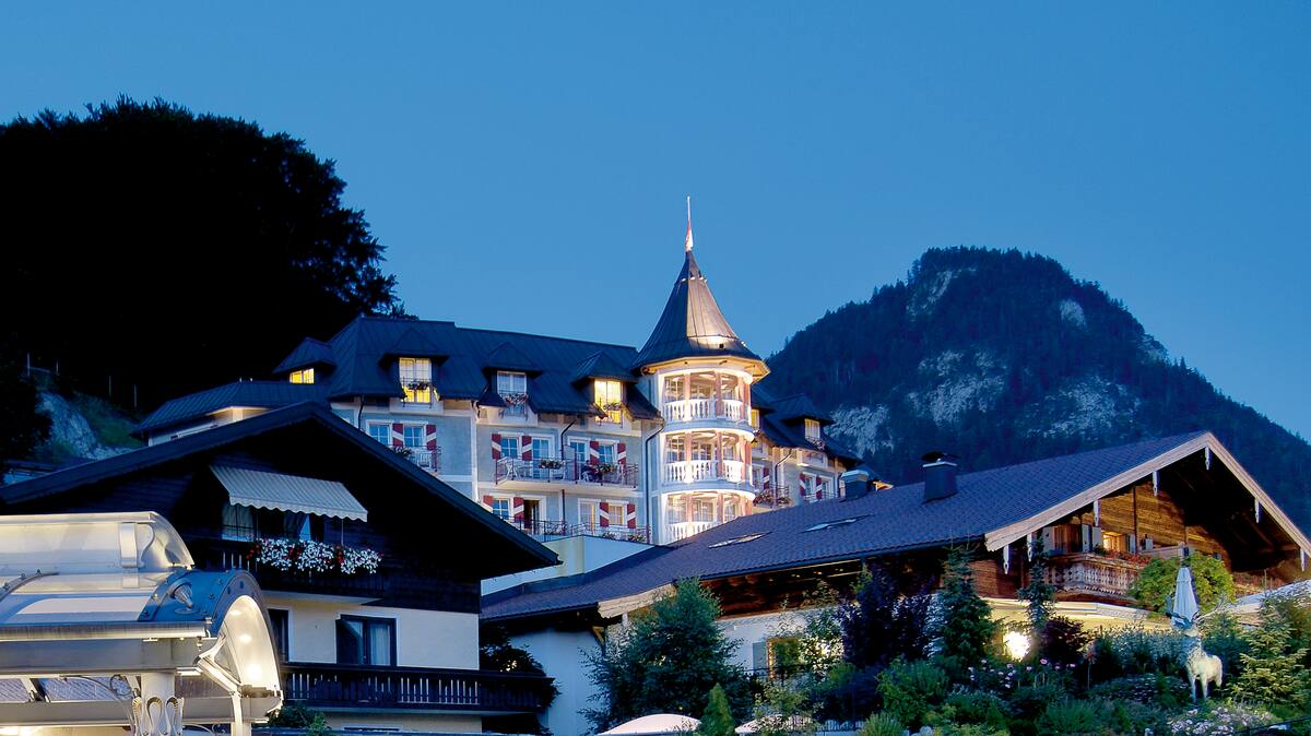 An exterior shot of Hotel Ebner's Waldhof in the evening light
