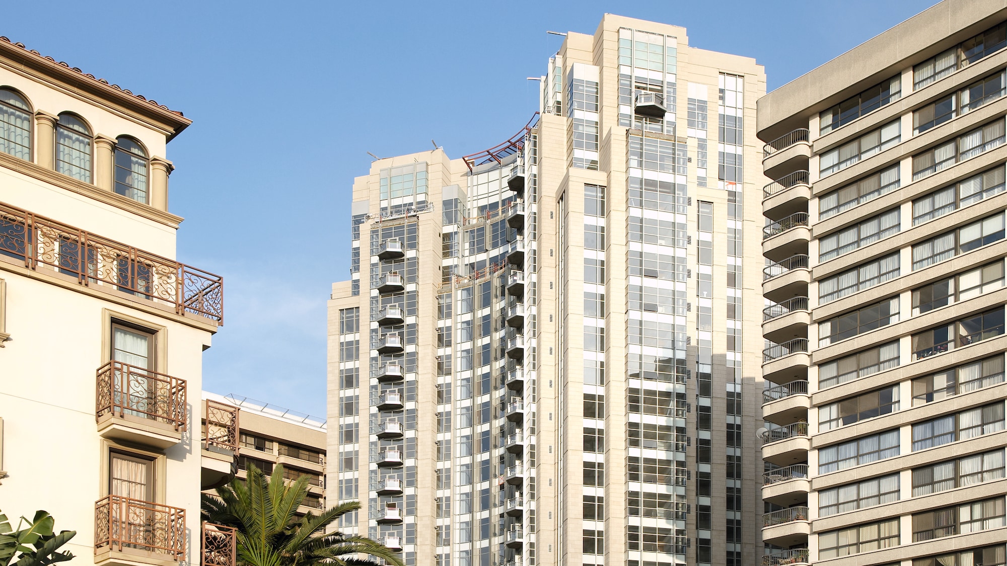 three adjacent white buildings
