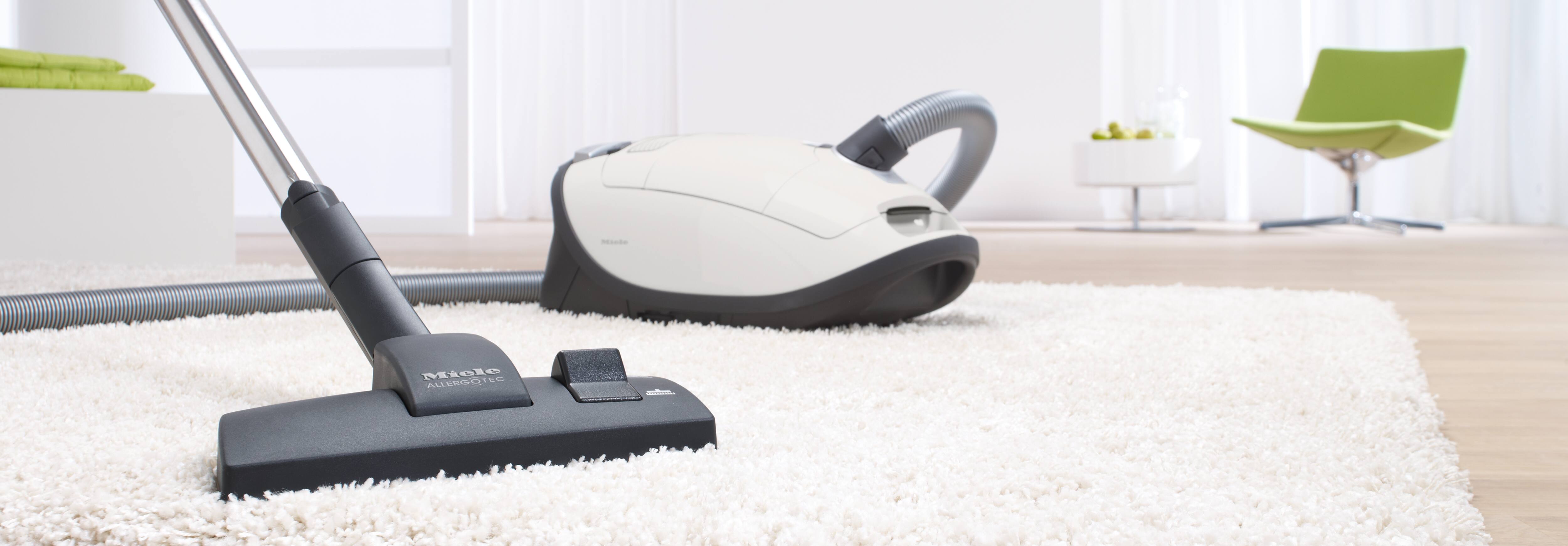 Miele Complete C3 Allergy vacuum cleaner in a modern living room setting Miele Complete C3 Allergy vacuum cleaner in a modern living room setting