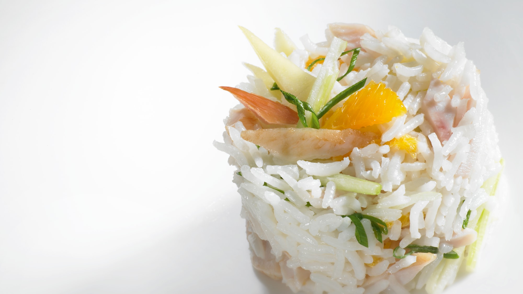 Chef hands using tweezers to edit vegtables on a metal tray