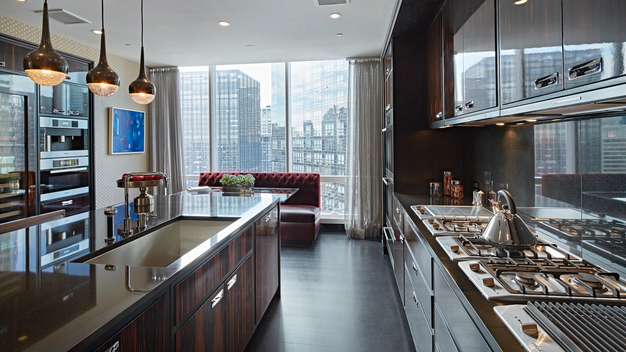 Kitchen interior showing Miele appliances blending with wooden cabinetry