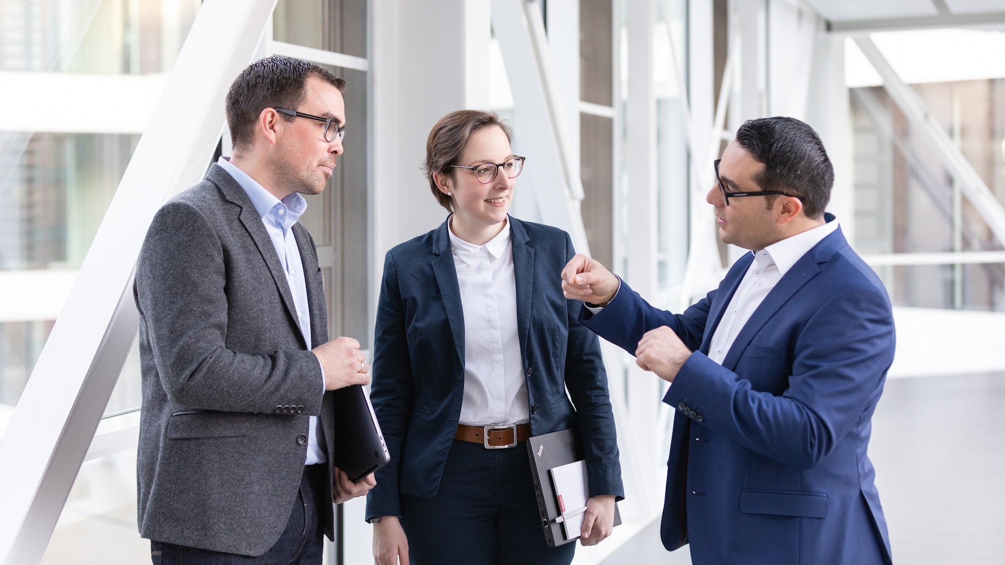 3 businessmen exchanging ideas