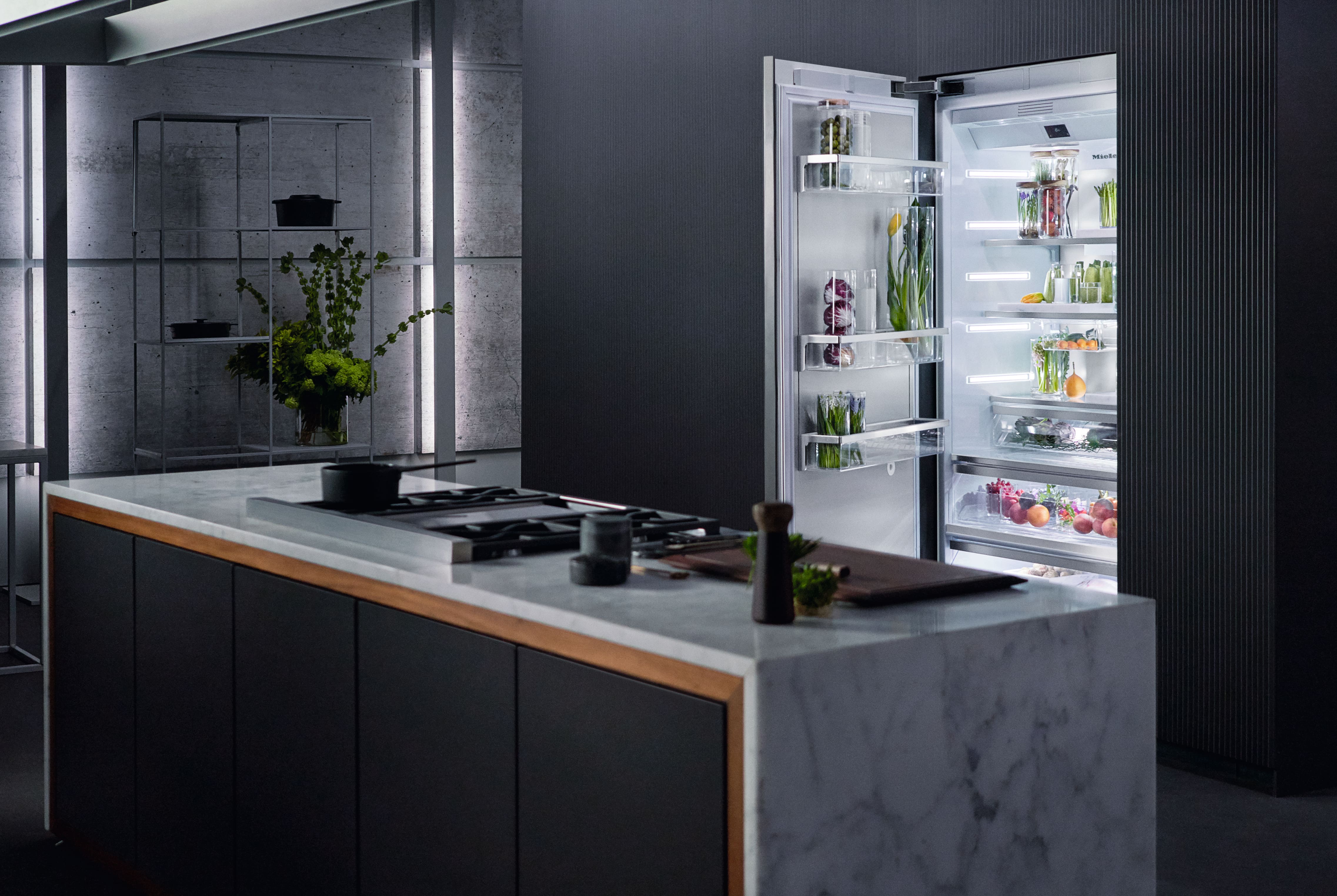 Miele built-in MasterCool with its door open in a modern kitchen setting