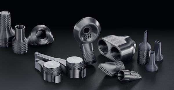 Miele spear parts on a black surface