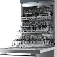 Opened SlimLine laboratory washer, where baskets are placed on three levels and loaded with laboratory glassware.