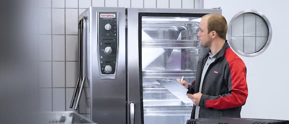 Miele Professional technician checks commercial washer-disinfector