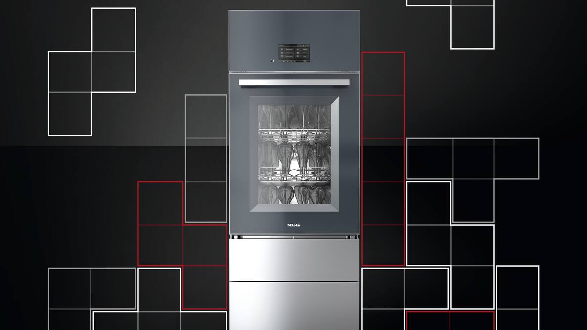 Slim, tall laboratory washer filled with laboratory glassware is placed in front of a black background with Tetris symbols.