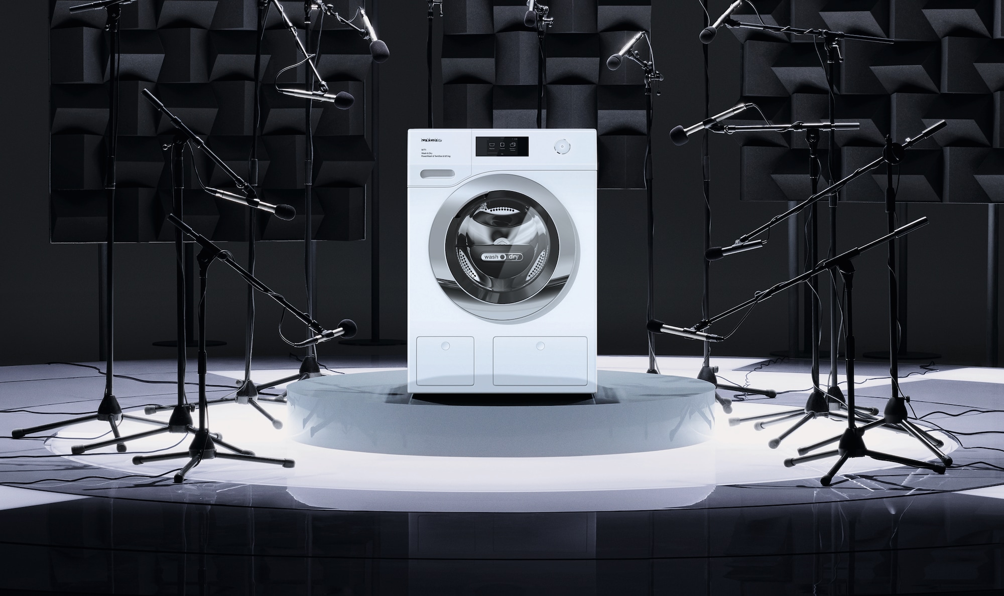 A Miele washing machine surrouned by splashes of water