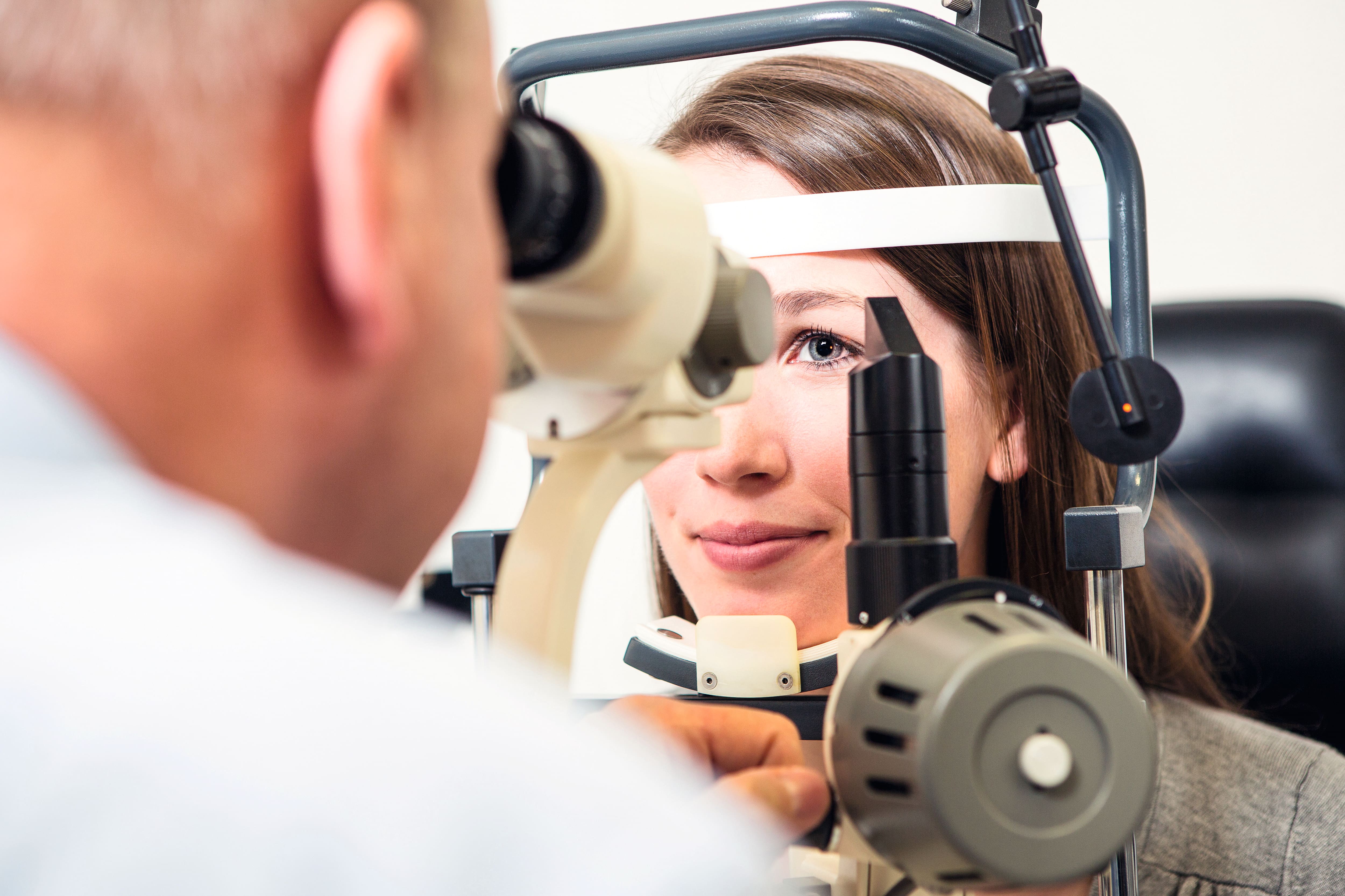 Ophthalmological examination of a woman's eye.