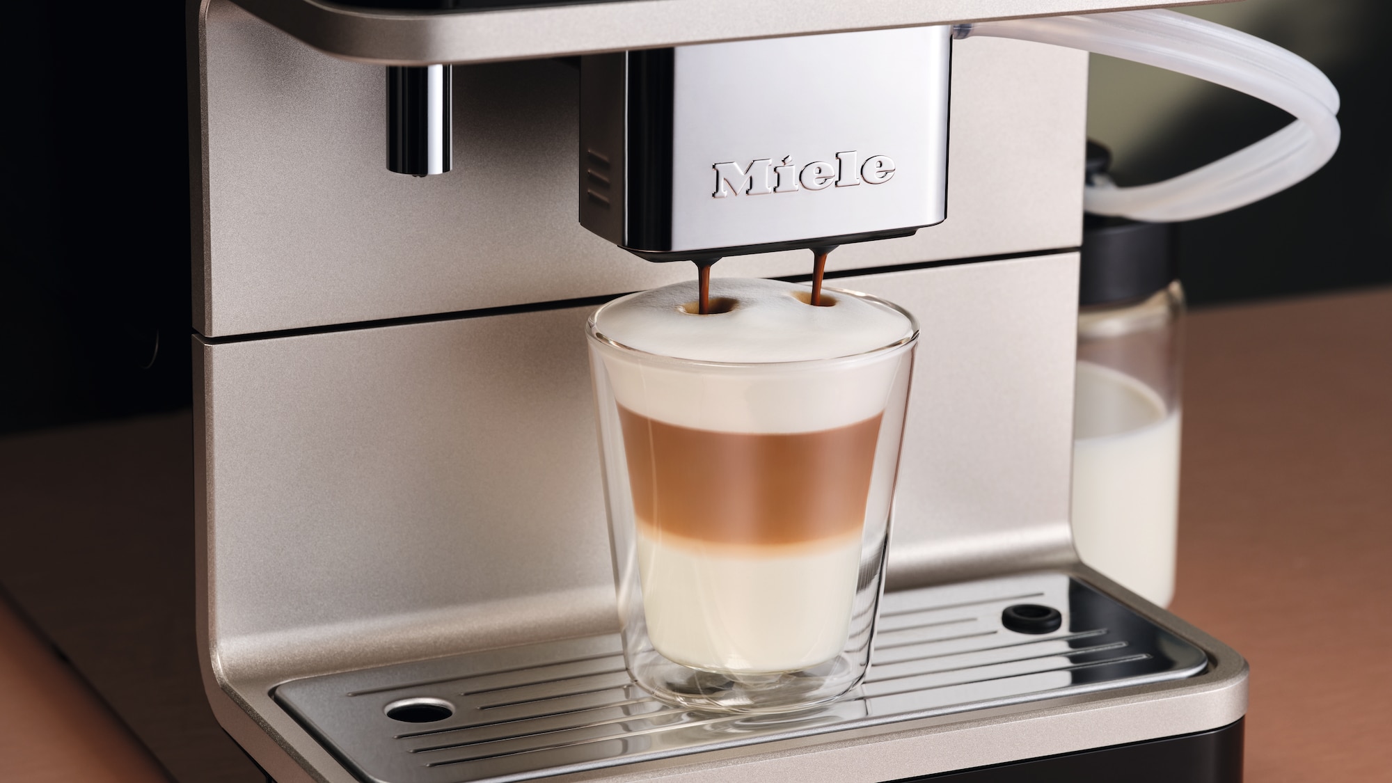 A latte macchiato being prepred with a Miele coffee machine 