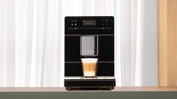 The Miele CM5 coffee machine on display on a kitchen countertop