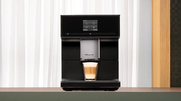 The Miele CM7 coffee machine on display on a kitchen countertop