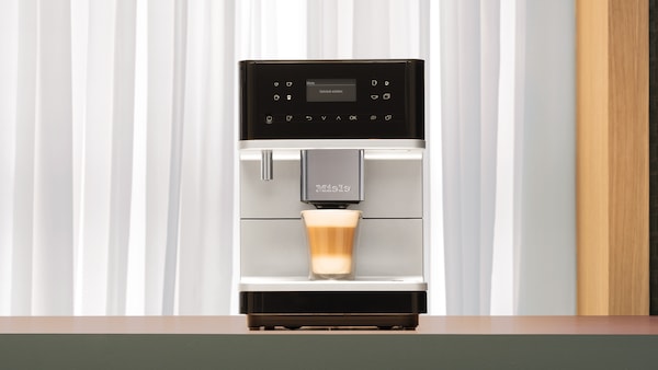 The Miele CM6 coffee machine on display on a kitchen countertop