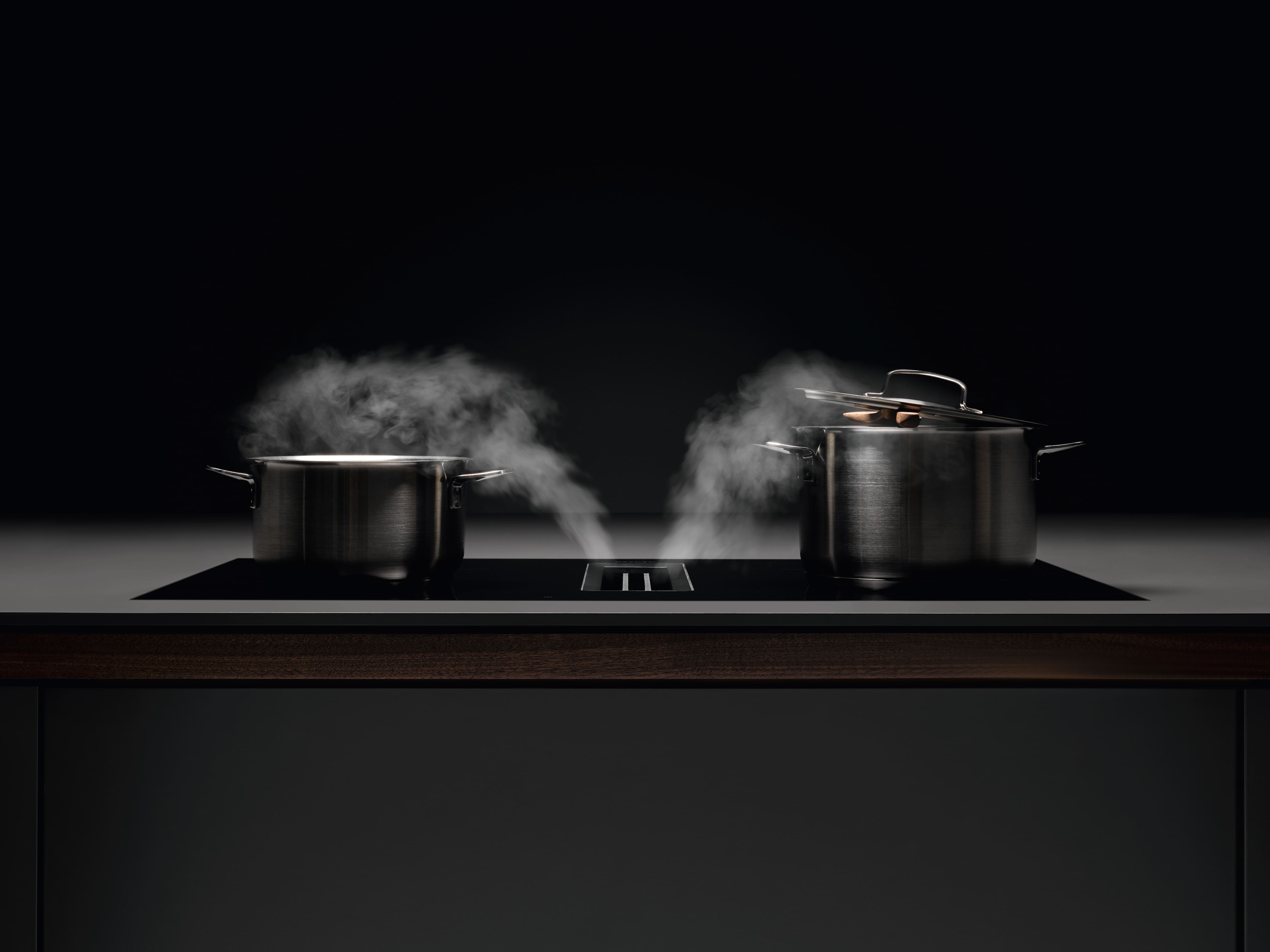 Two steaming pods on the Miele hob with built in hood