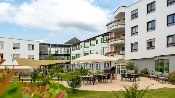 The inner courtyard of a retirement home can be seen