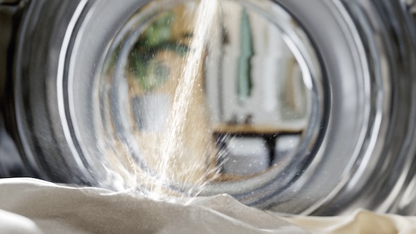 water splashing on clothes in a Miele washing machine