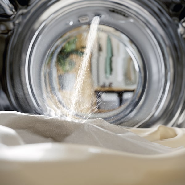 water falling on clothes inside a miele washing machine