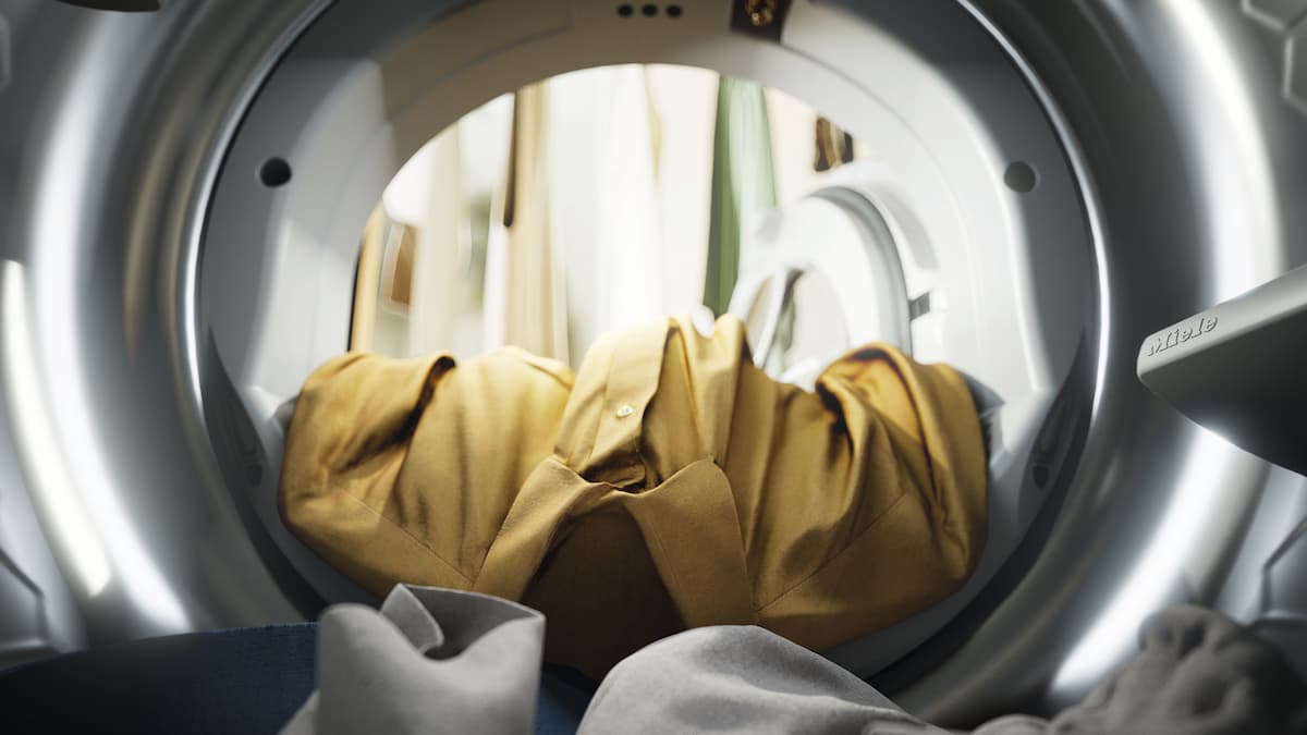 Yellow item of clothing in washing machine drum