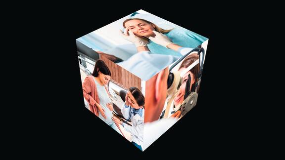 A cube with various photographic motifs can be seen. Various situations of patients in medical treatment are shown.