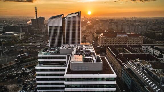 Bird's-eye view of high-rise buildings at sunset.