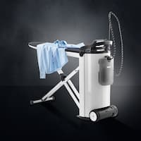 The Miele steam ironing system PIB 100 is displayed on a black background. On top of the ironing system lies a blue shirt.