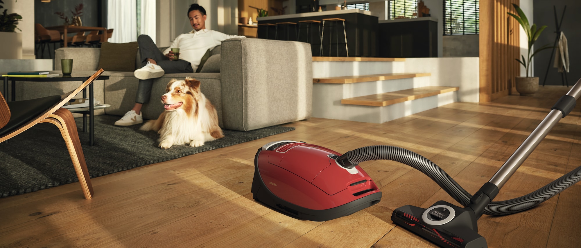 Miele vacuum cleaner next to a dog
