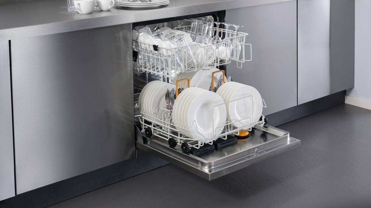 A dishwasher loaded with plates from Miele Professional
