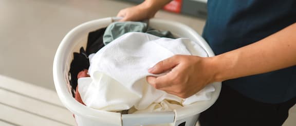 The Miele Professional Little Giants washing machine with the retrofittable coin-operated payment system is located in a launderette.