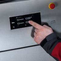 Finger operates the touch display on a Benchmark machine
