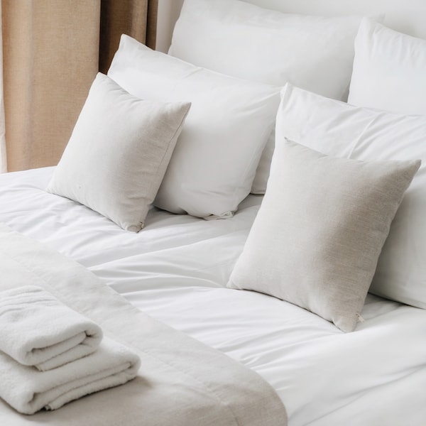 Bed with white bedding 