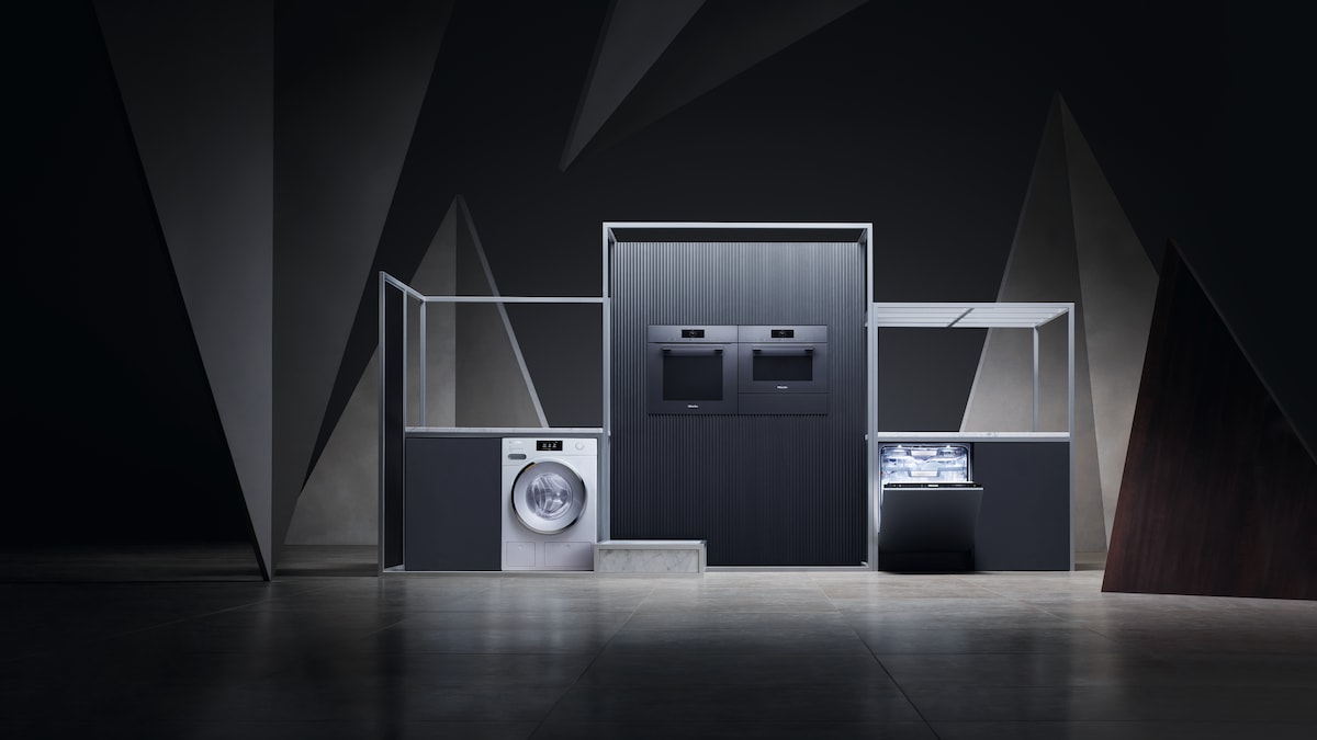 Miele appliances in a dark kitchen set up