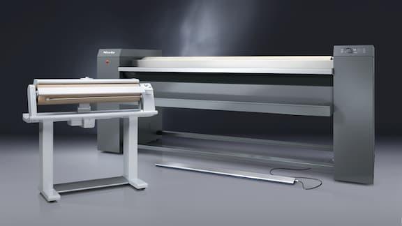 In one room there is a Miele Professional commercial white HM 16-83 and an iron grey PRI 217 ironer.
